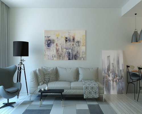 A warmly lit modern living room interior at dusk with a reading lamp